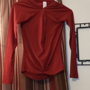 Red long sleeve button up shirt.